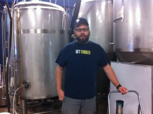 Dave Reed of Forked River Brewing, standing by some barrels