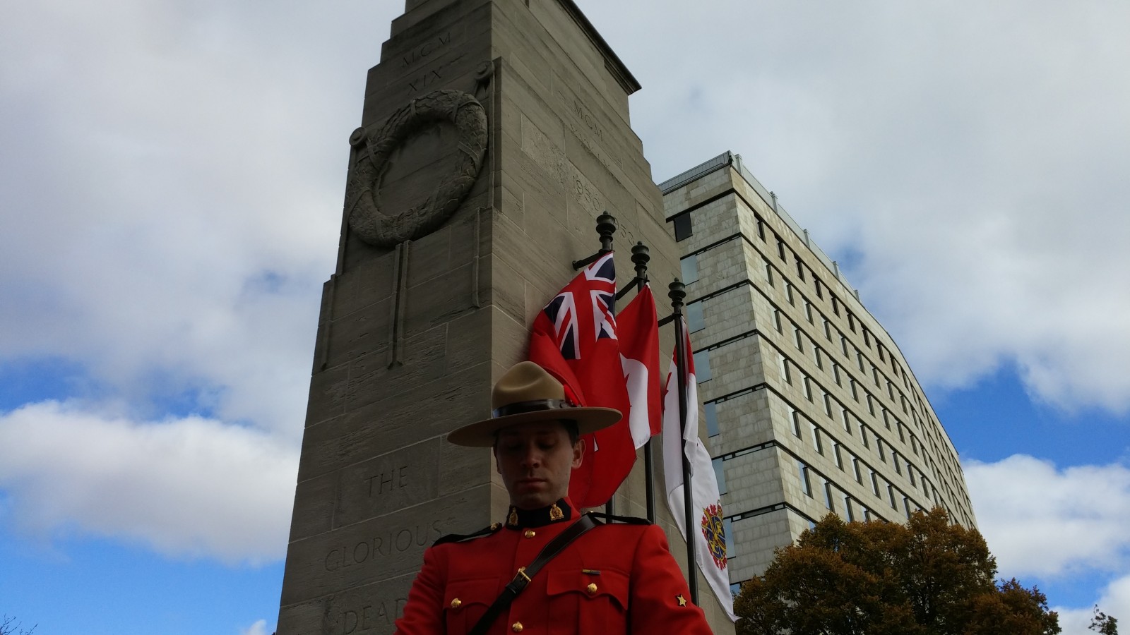 An RCMP officer stands in reverence at the Victoria Park Cenotaph Remembrance Day ceremonies in London, Ontario. 
