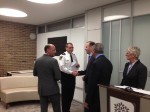 Mayor Matt Brown and Councillor Stephen Turner shake hands with Chief of Police John Pare.